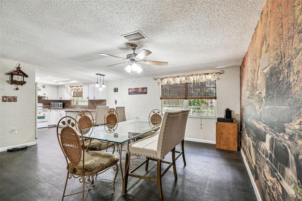 9741 Star Trail New Port Richey, FL 34654 - Photo 24 of 38 a dining room with furniture and window