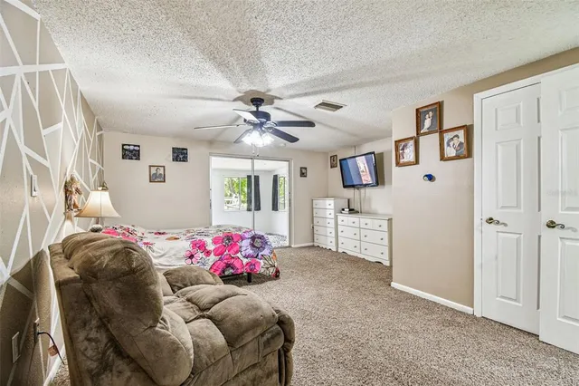 a bedroom with furniture and a window