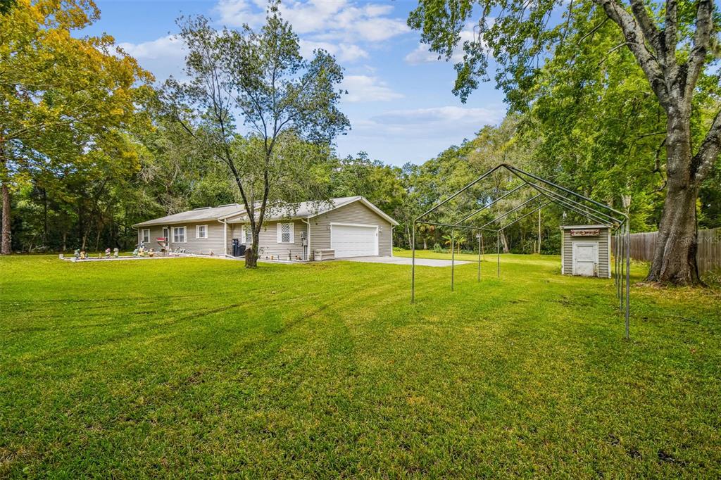 9741 Star Trail New Port Richey, FL 34654 - Photo 5 of 38 a house view with swimming pool in front of it