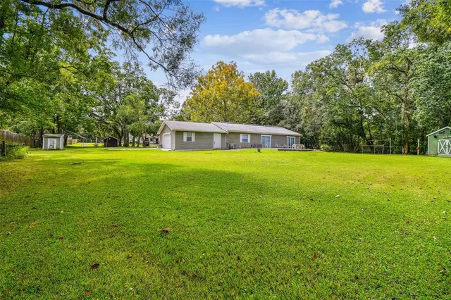 a view of a swimming pool with an outdoor space and seating area
