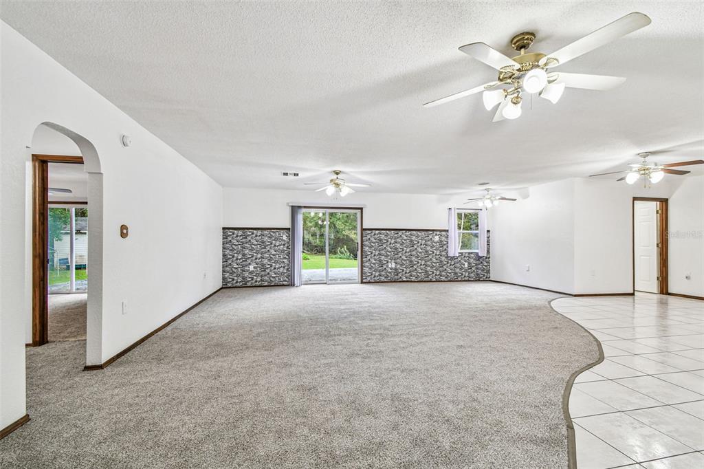 9741 Star Trail New Port Richey, FL 34654 - Photo 8 of 38 a view of a livingroom with a ceiling fan and window