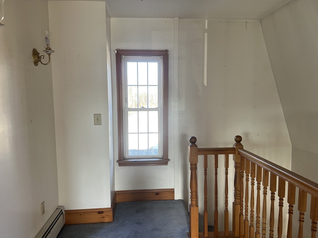 1261 G A R Highway Swansea, MA 02777 - Photo 19 of 25 a view of a hallway with windows