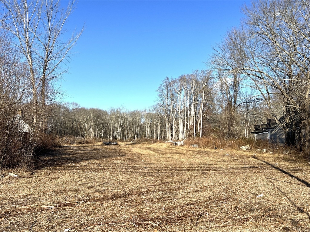 1261 G A R Highway Swansea, MA 02777 - Photo 2 of 25 a view of road with large trees