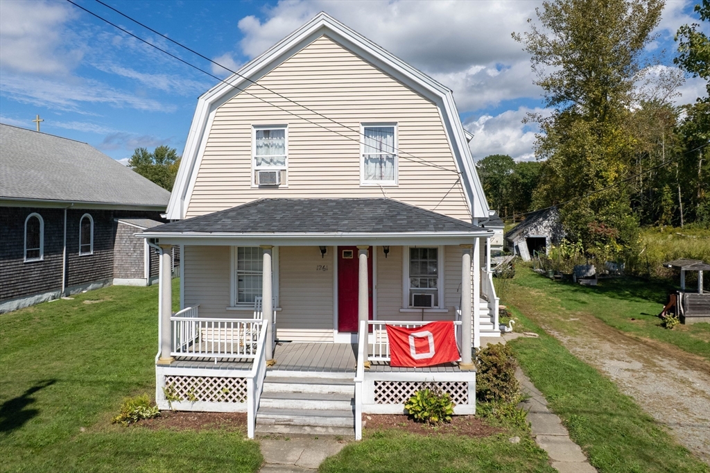 1261 G A R Highway Swansea, MA 02777 - Photo 3 of 25 a front view of a house with garden