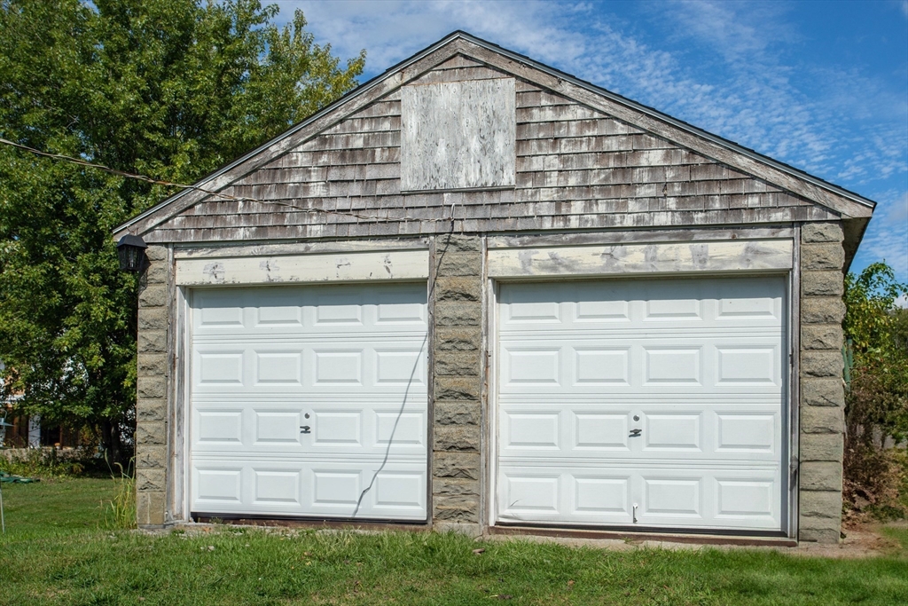1261 G A R Highway Swansea, MA 02777 - Photo 7 of 25 a front view of a house with a yard