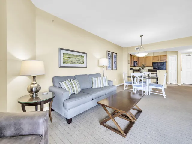 a bedroom with a bed and painting on the wall