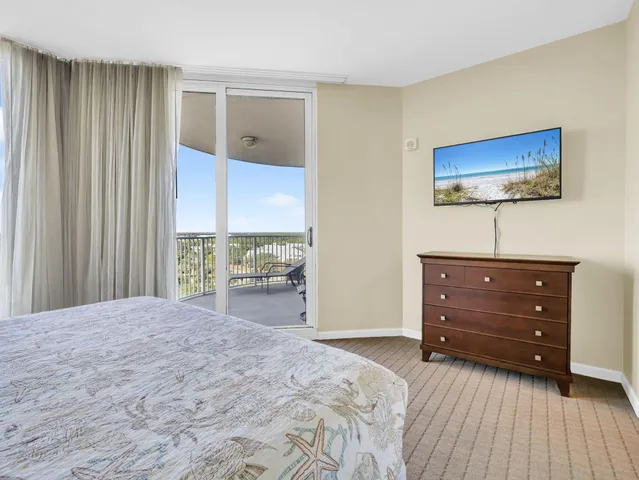 a view of a chairs and table in the balcony