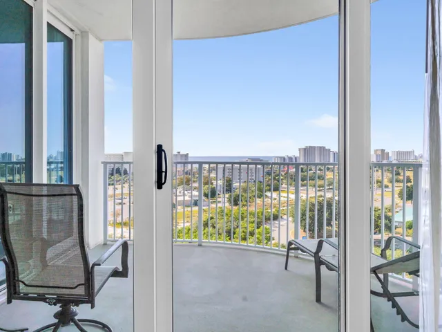 a kitchen with stainless steel appliances a refrigerator stove microwave and white cabinets