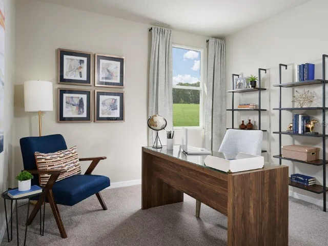 a work room with furniture and a window