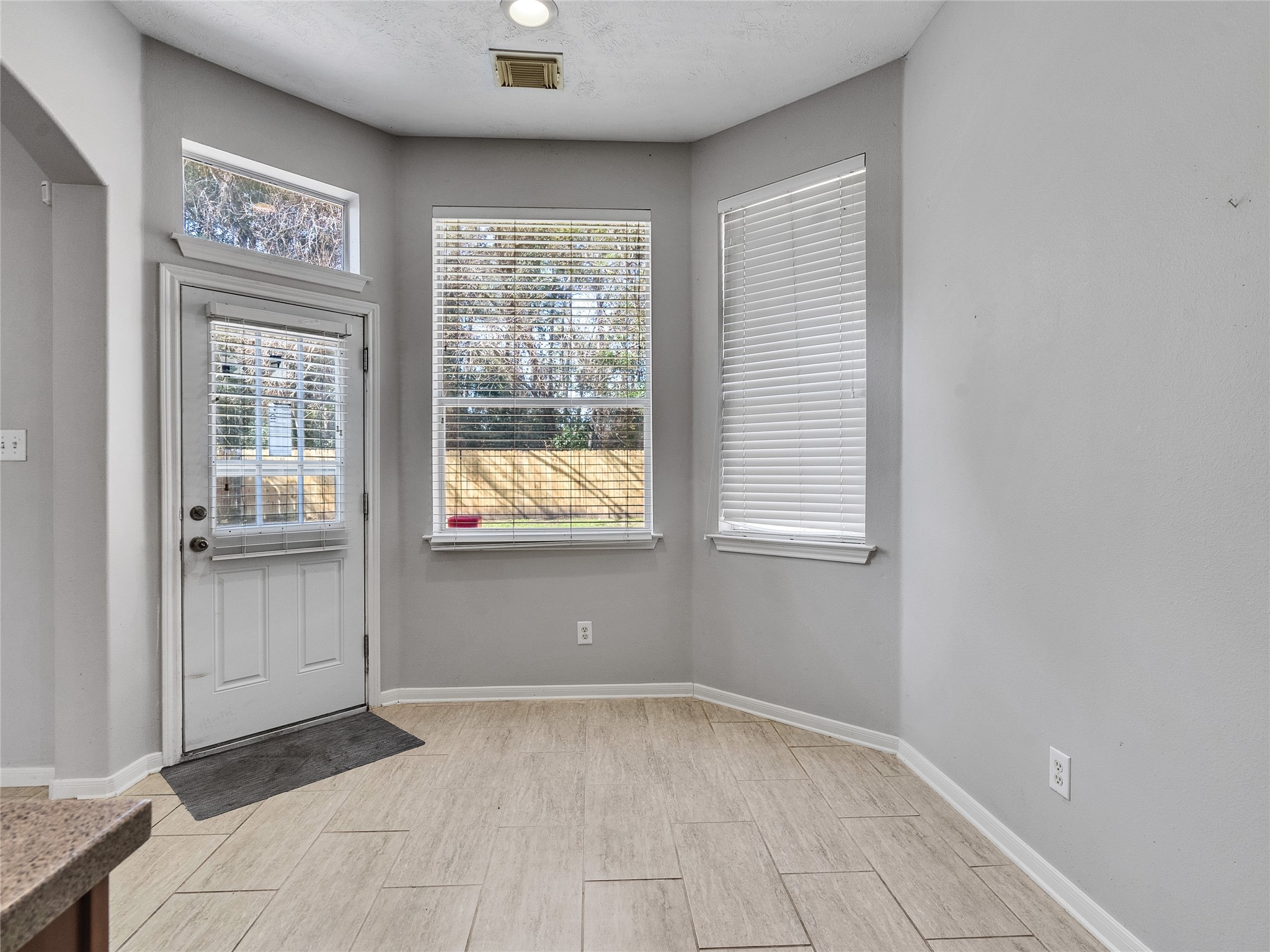 2615 Fern Lacy Drive Spring, TX 77388 - Photo 14 of 32 A cozy breakfast area is conveniently located near the back door to also provide a quick escape into the huge backyard