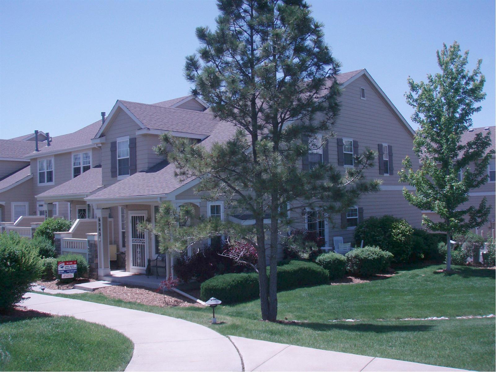 6243 Trailhead Road Highlands Ranch, CO 80130 - Photo 1 of 1 a view of a house with a yard