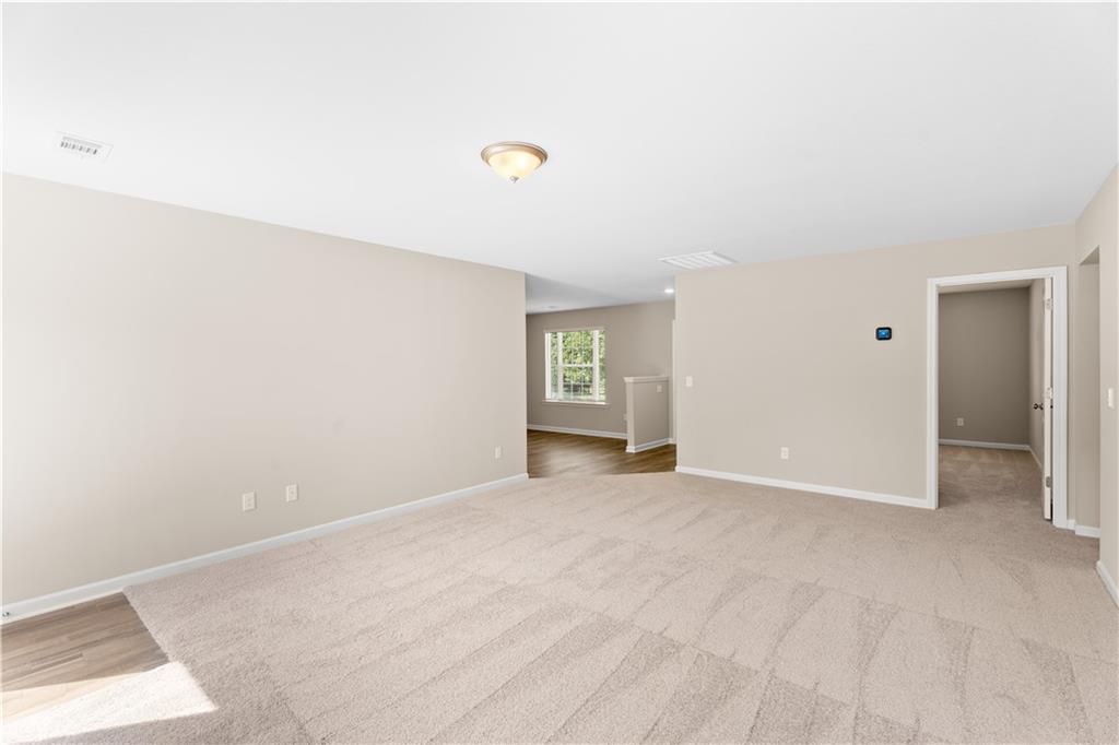 31 Whiterock Road Phenix City, AL 36869 - Photo 31 of 36 Empty room with light carpet and baseboards