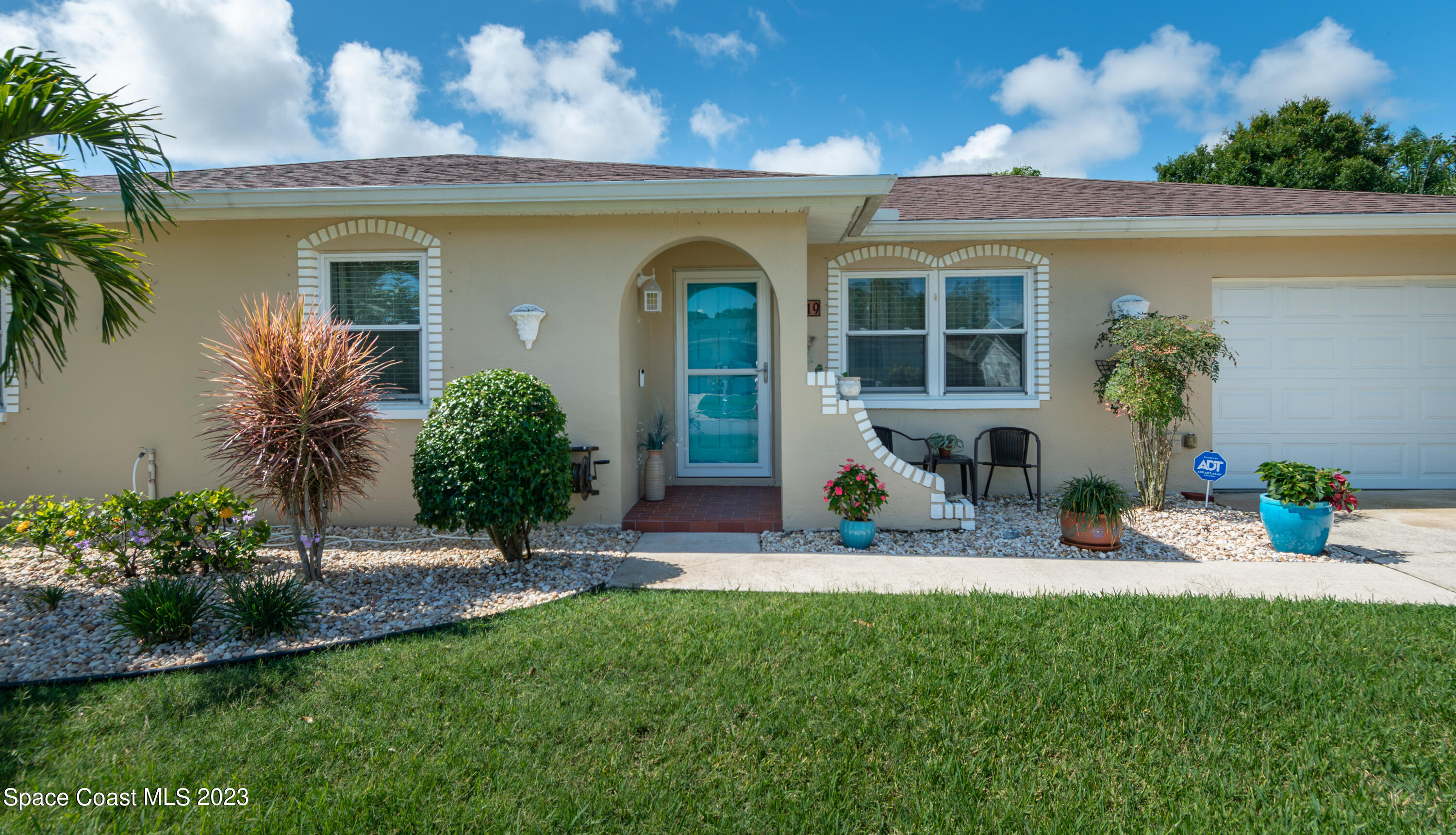 1919 Player Circle North Melbourne, FL 32935 - Photo 2 of 29 a view of house with outdoor space and porch