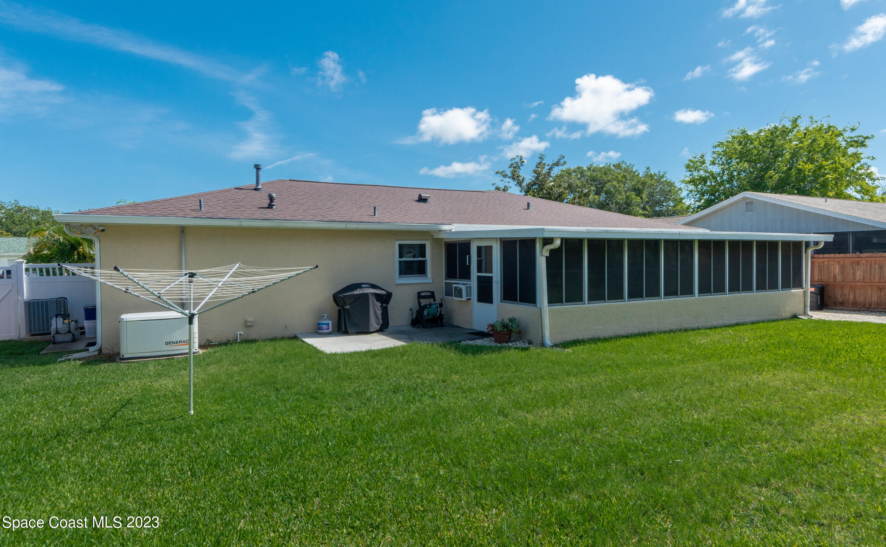 1919 Player Circle North Melbourne, FL 32935 - Photo 24 of 29 a view of a house with a backyard