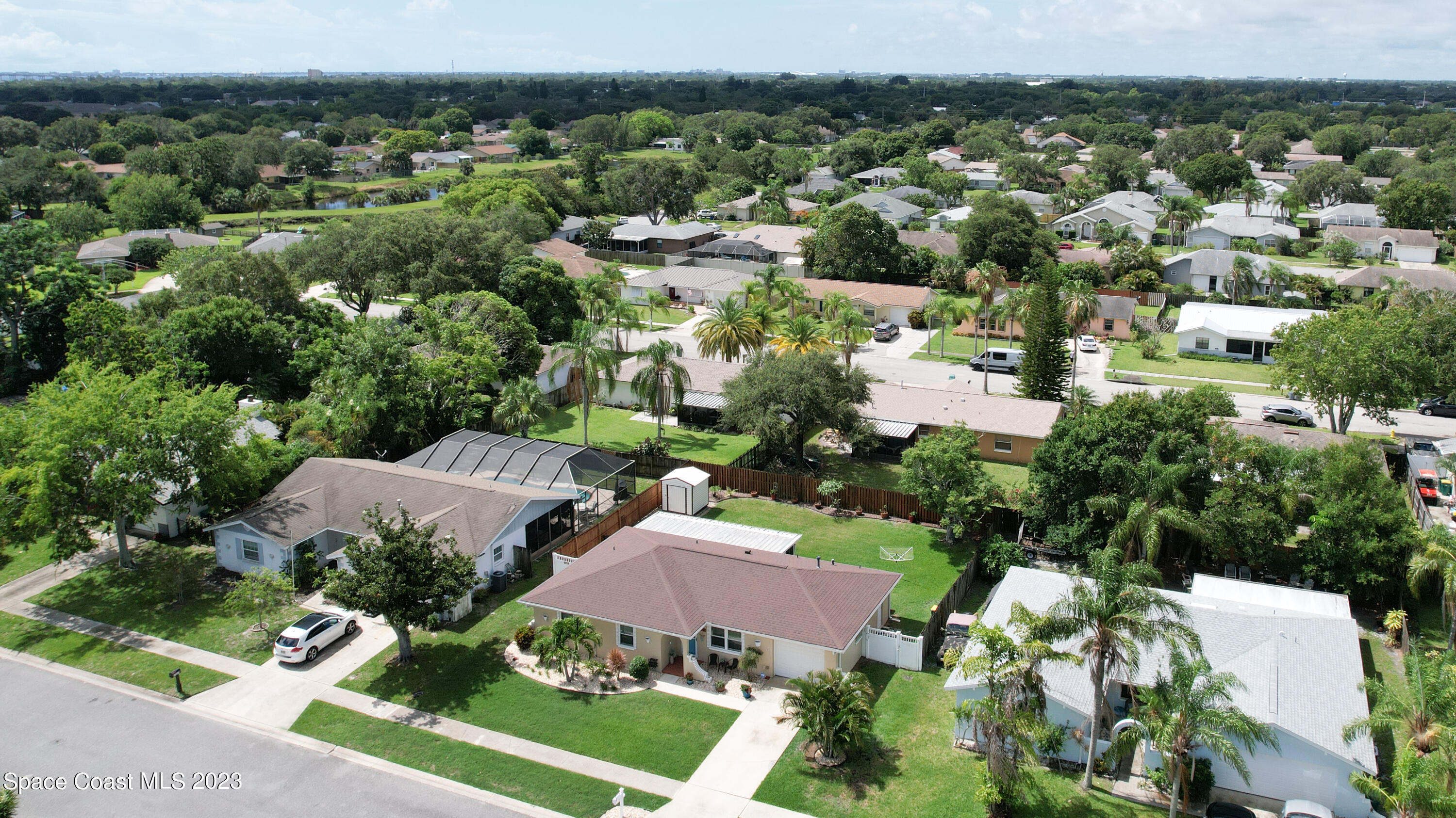 1919 Player Circle North Melbourne, FL 32935 - Photo 26 of 29 an aerial view of multiple house