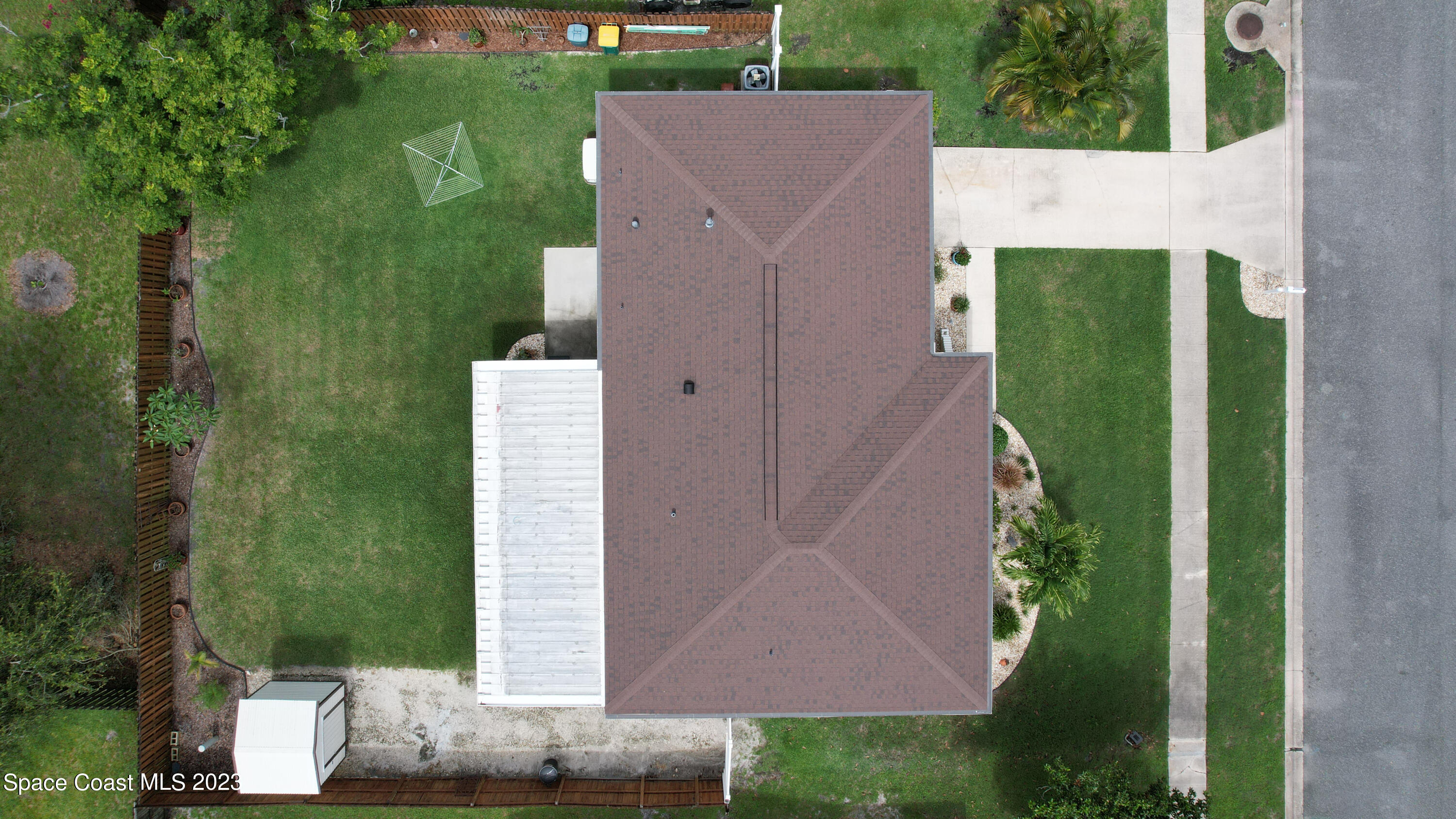 1919 Player Circle North Melbourne, FL 32935 - Photo 28 of 29 an aerial view of a house with a yard