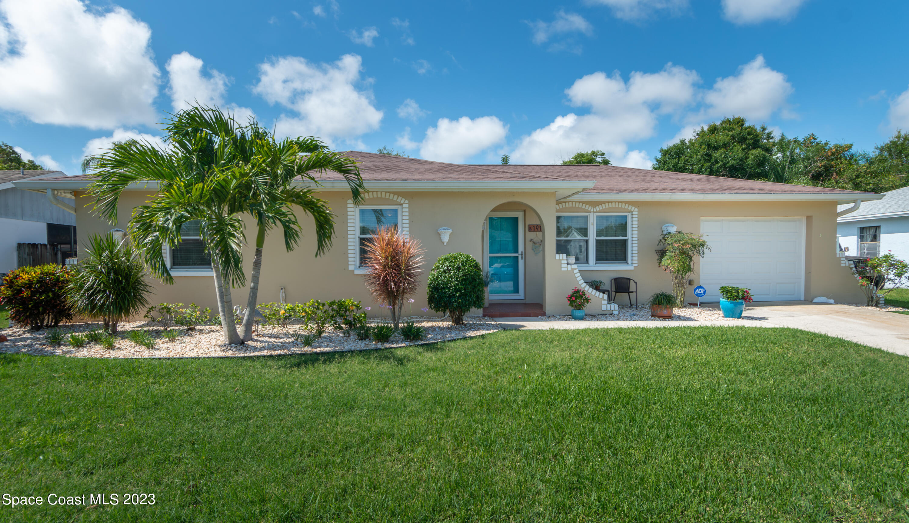 1919 Player Circle North Melbourne, FL 32935 - Photo 3 of 29 a view of a house with backyard and porch