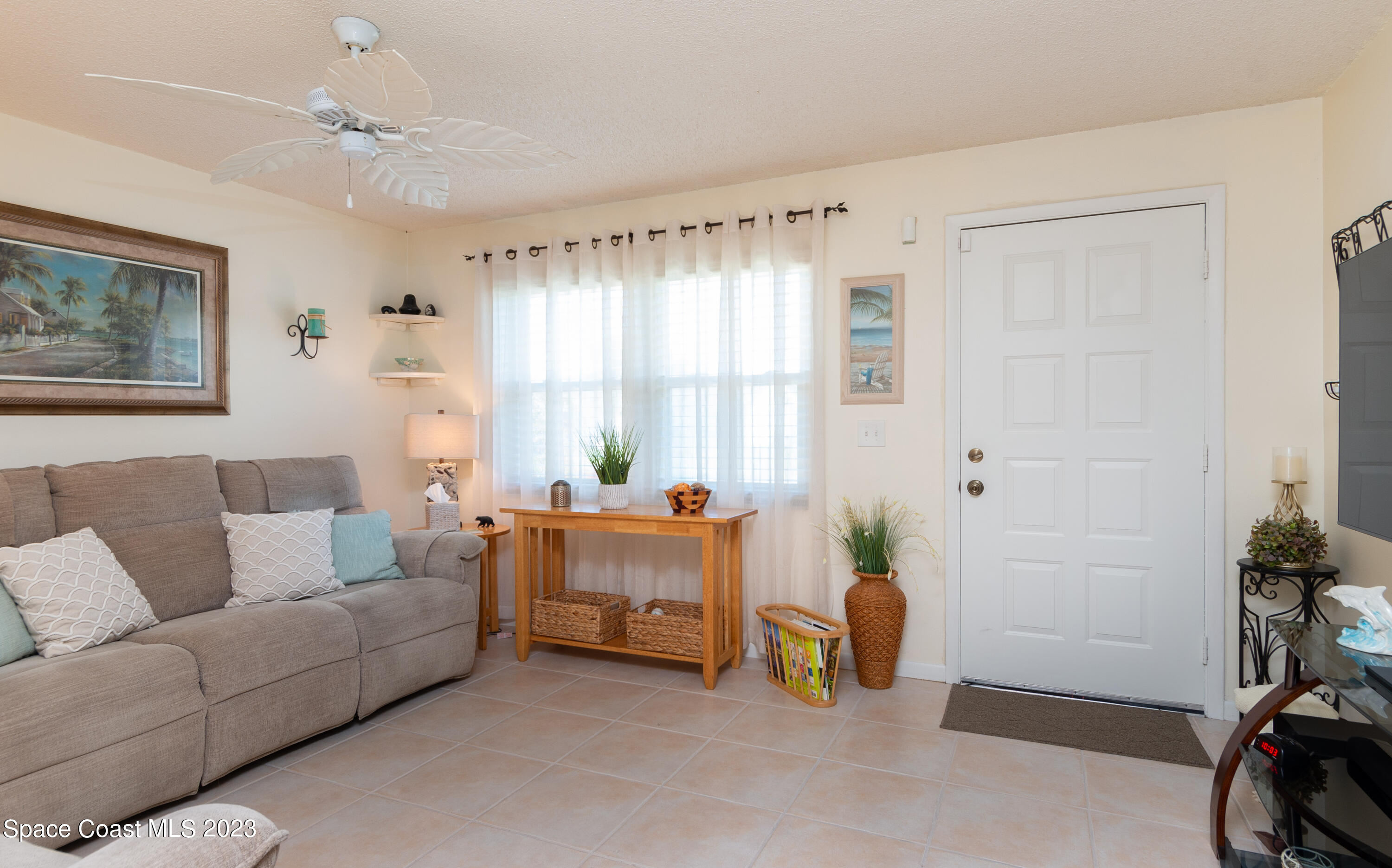 1919 Player Circle North Melbourne, FL 32935 - Photo 5 of 29 a living room with furniture and a window