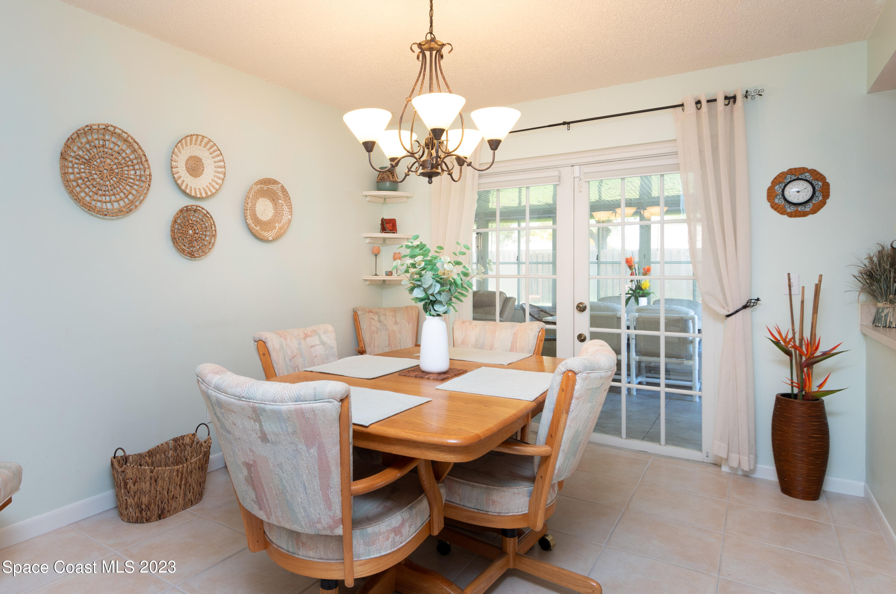 1919 Player Circle North Melbourne, FL 32935 - Photo 10 of 29 a dining room with furniture and a large window