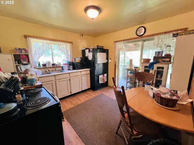 a room with furniture a large window and gym equipment