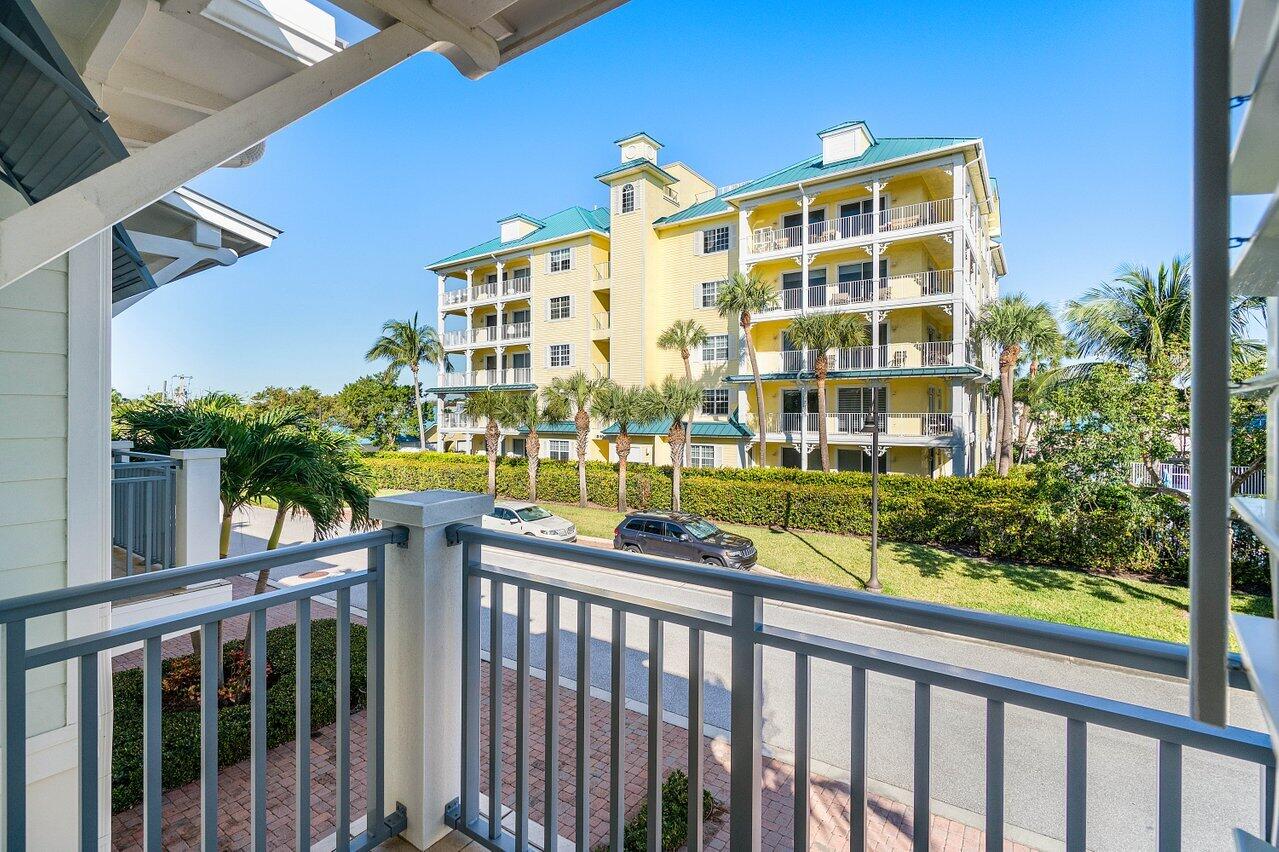 136 Ocean Breeze Drive Juno Beach, FL 33408 - Photo 26 of 30 a front view of a building with garden and plants
