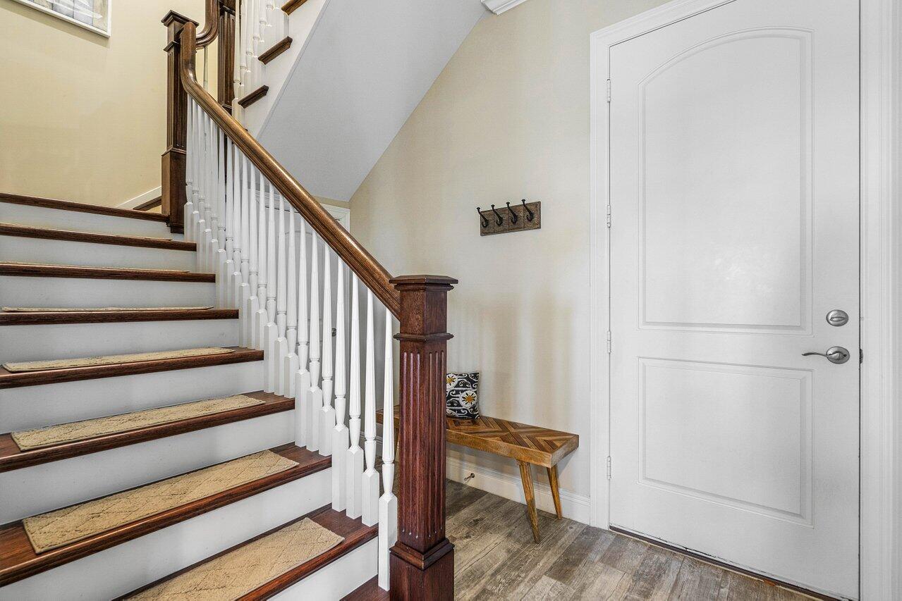 136 Ocean Breeze Drive Juno Beach, FL 33408 - Photo 5 of 30 a view of entryway with wooden floor and stairs