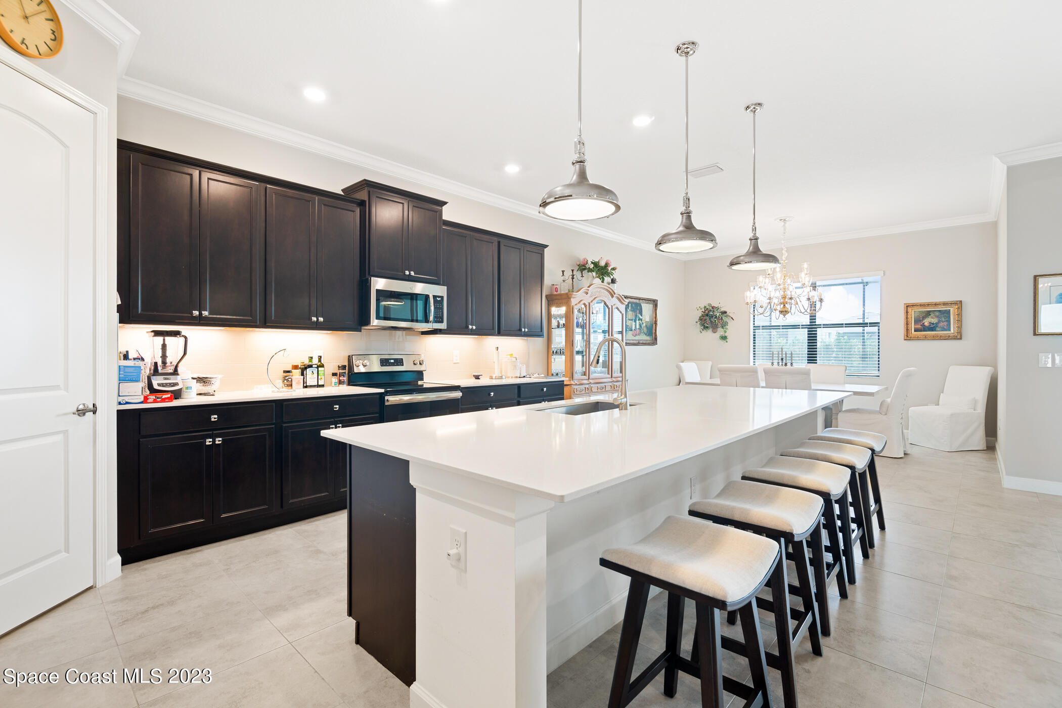 2579 Millennium Circle Melbourne, FL 32940 - Photo 17 of 42 a large kitchen with a table and chairs