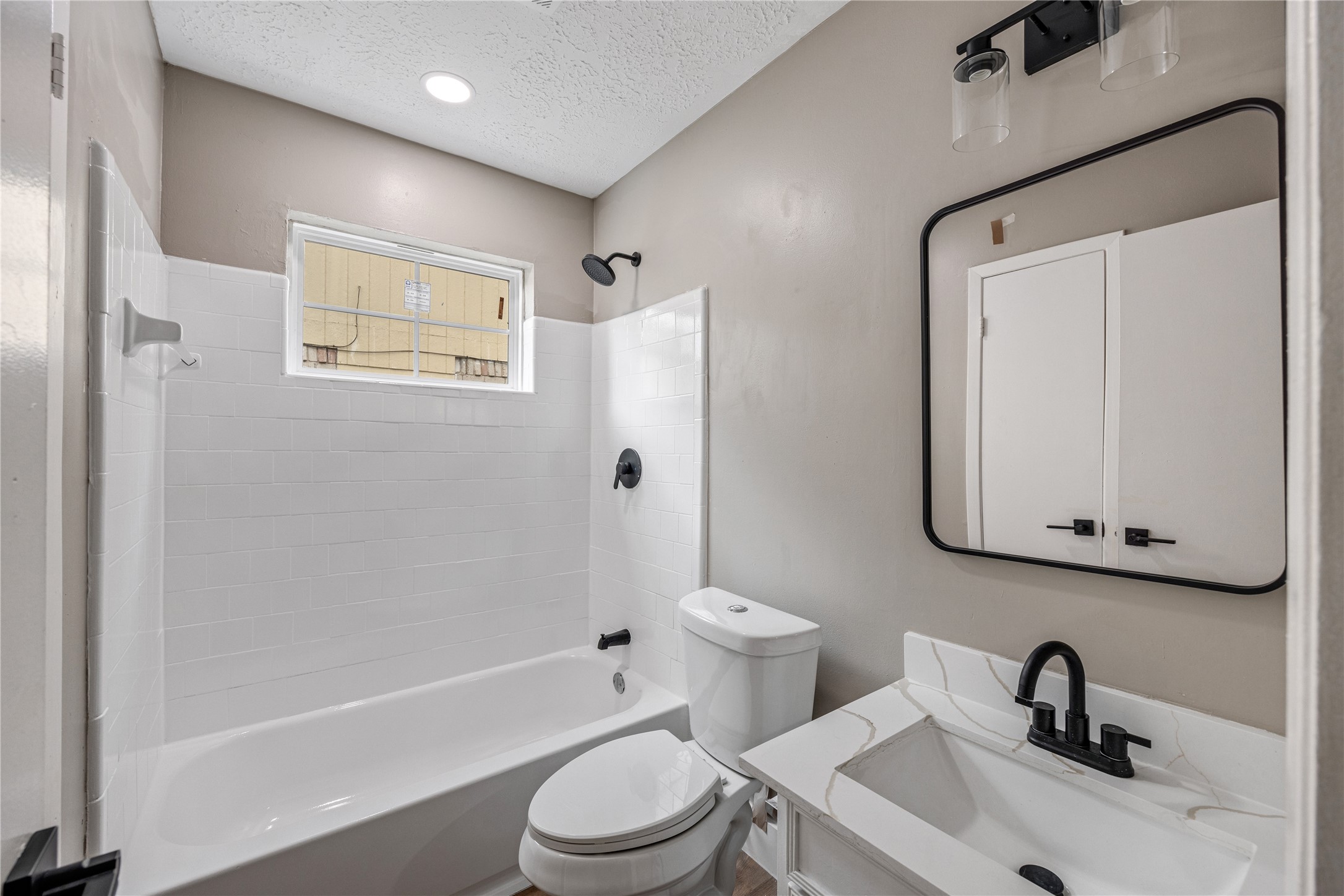 4515 Mossygate Drive Spring, TX 77373 - Photo 22 of 31 a bathroom with a sink toilet and shower
