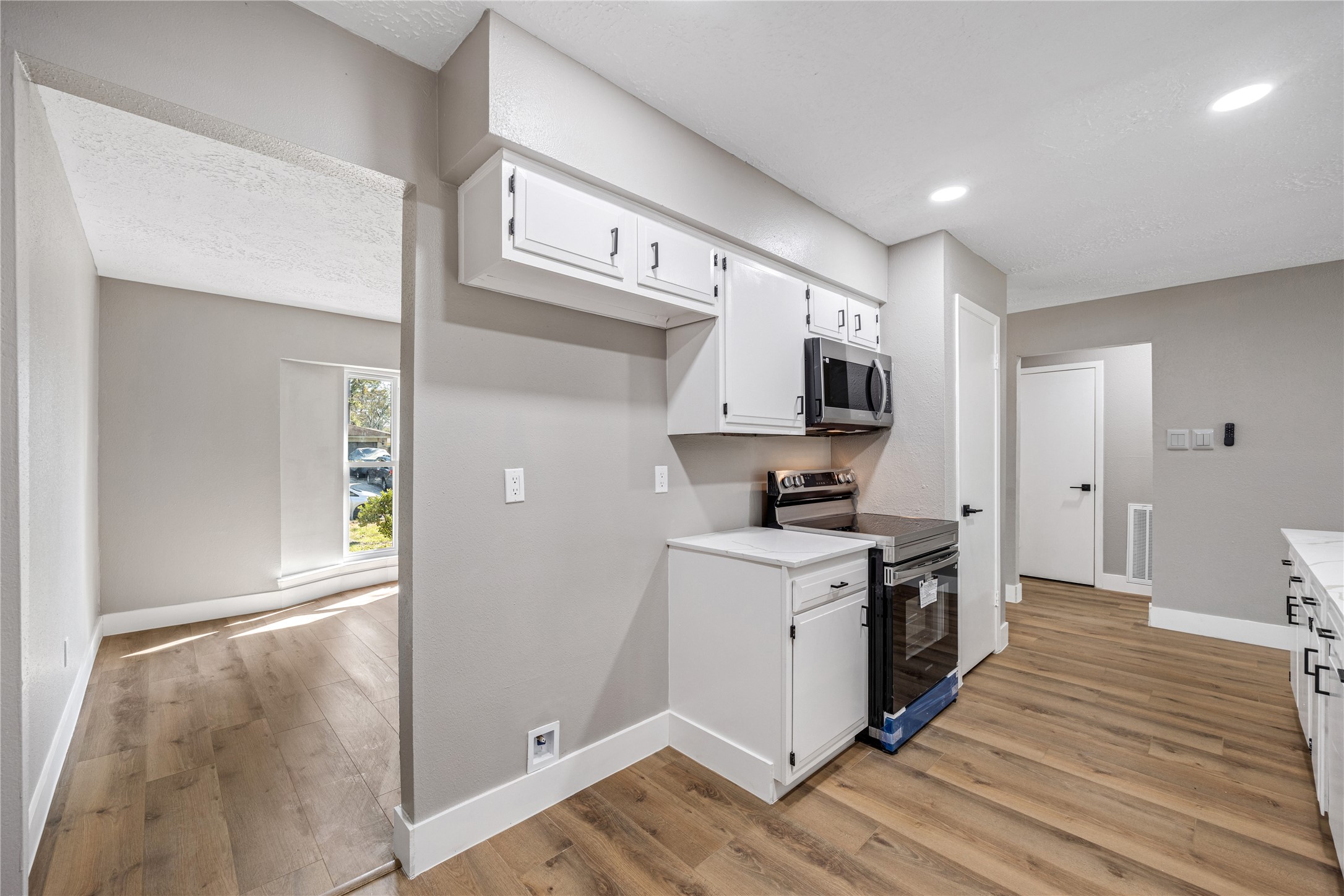 4515 Mossygate Drive Spring, TX 77373 - Photo 8 of 31 a kitchen with a stove a sink and a refrigerator