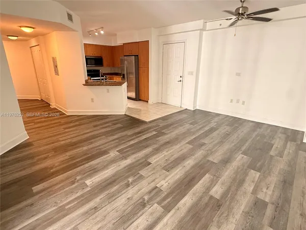 a view of an empty room with a window