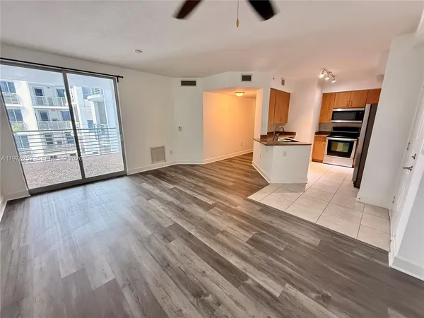 a view of an empty room with a door