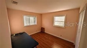 a room with window and a wooden floor