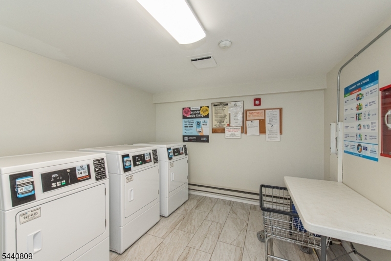 206 Main Street, Unit 42A Millburn, NJ 07041 - Photo 18 of 21 a room with storage and utility