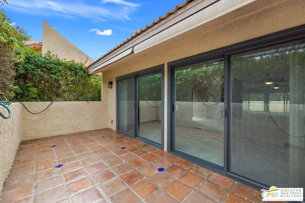 a view of a glass door with a outdoor space