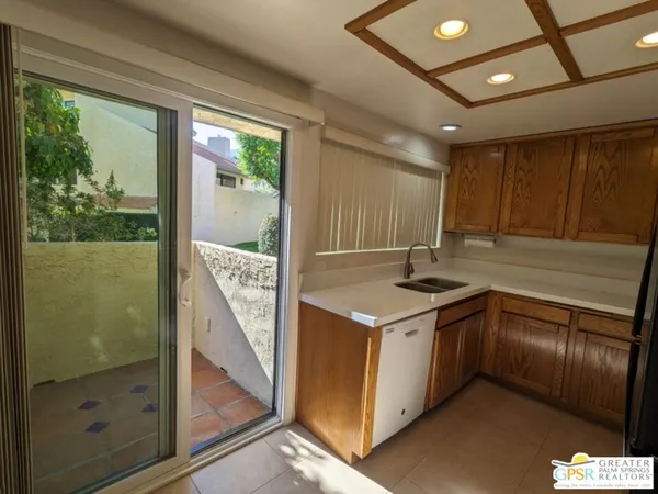 a kitchen that has a sink and a stove