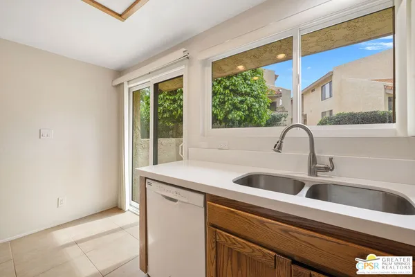 a kitchen with a stove and a microwave