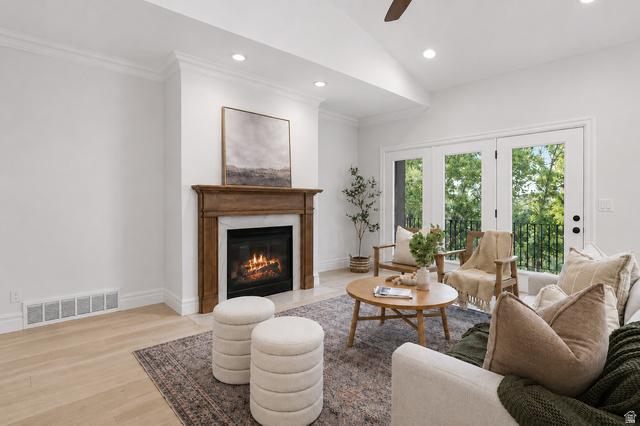 1429 Chateau Ridge Way Sandy, UT 84092 - Photo 6 of 22 Living area featuring wood-finish flooring, a fireplace with a wood mantel and stone surround, recessed lighting, and crown molding