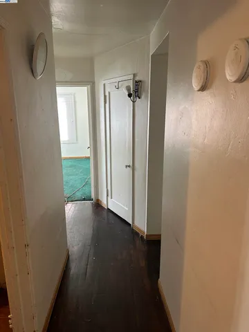 a view of a bathroom from a hallway