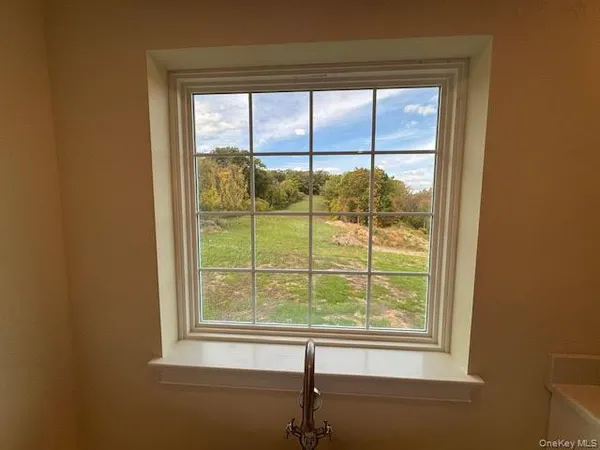 a white bath tub sitting next to a window