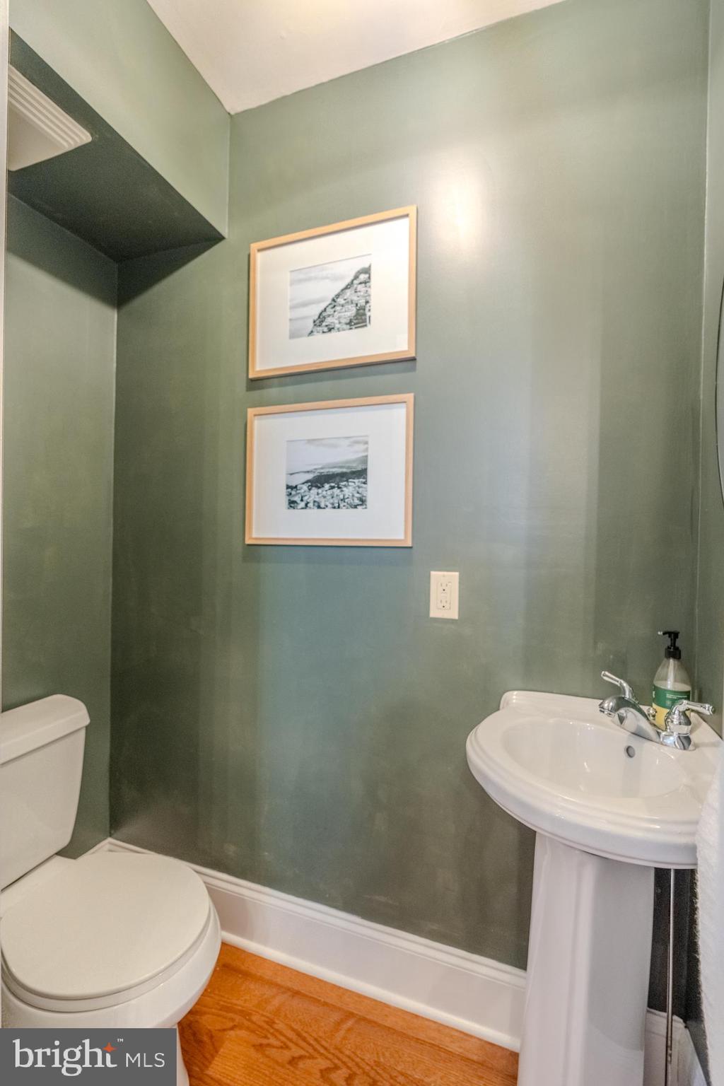 315 West Spring Avenue Ardmore, PA 19003 - Photo 16 of 42 a bathroom with a toilet sink and mirror