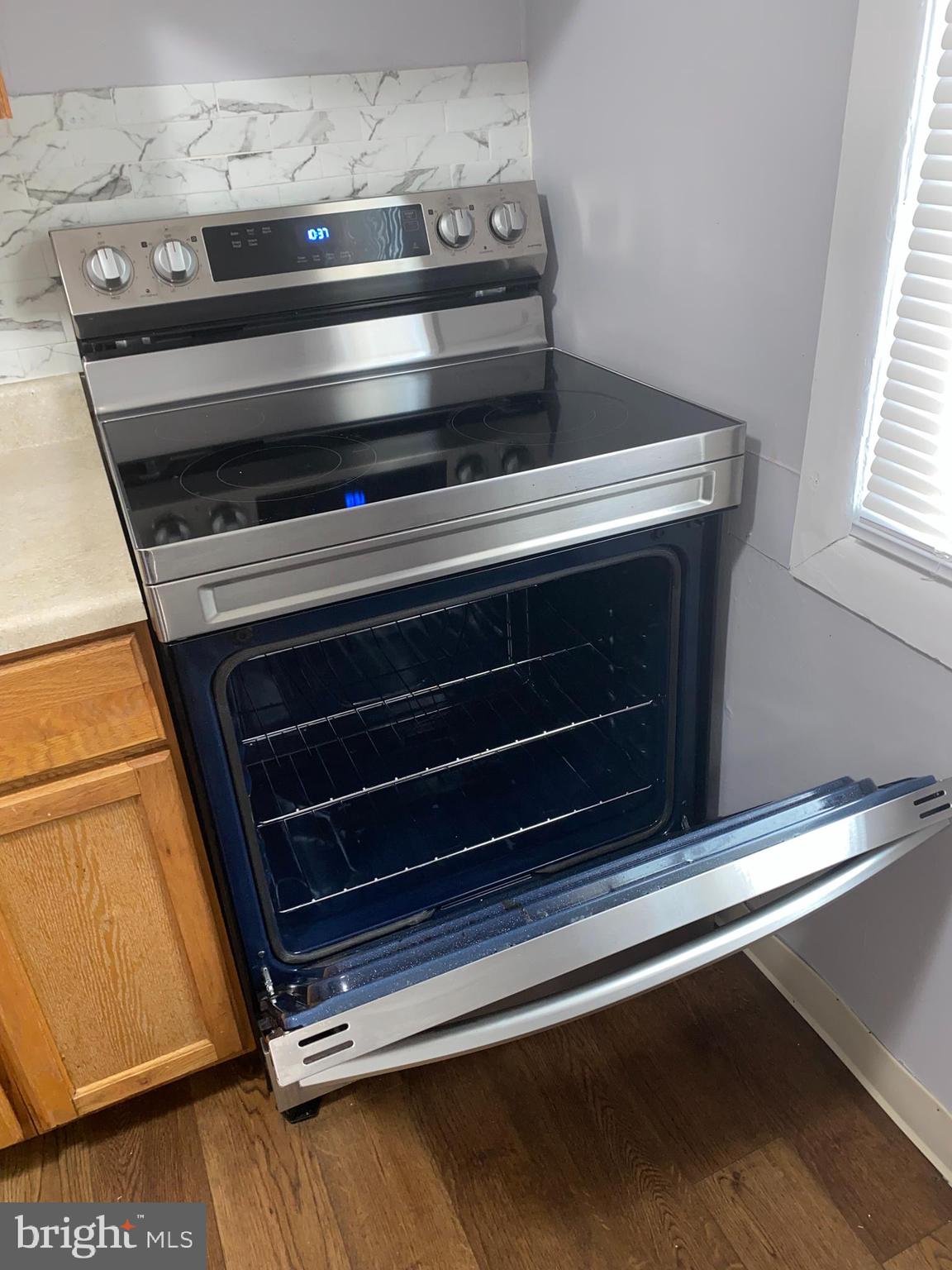 240 East Avon Road Brookhaven, PA 19015 - Photo 10 of 10 a stove top oven sitting inside of a kitchen