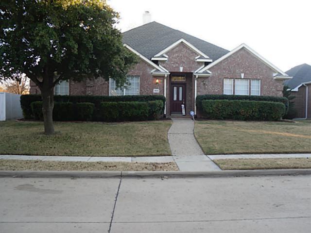 a front view of a house with yard