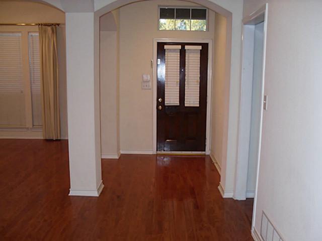 3824 Lowrey Way Plano, TX 75025 - Photo 2 of 10 a view of a hallway with wooden floor