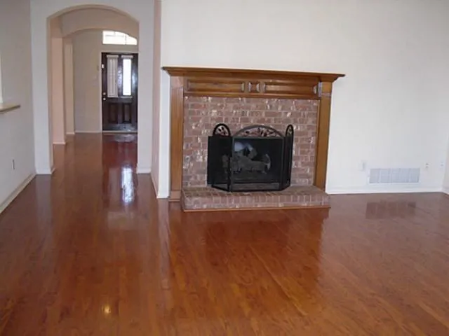 wooden floor with fireplace and wooden floor