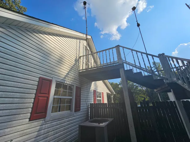 a view of balcony with wooden floor