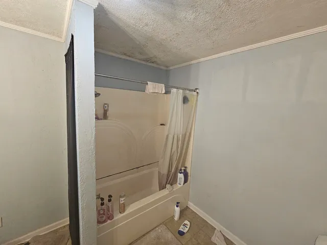 a bathroom with a sink and shower