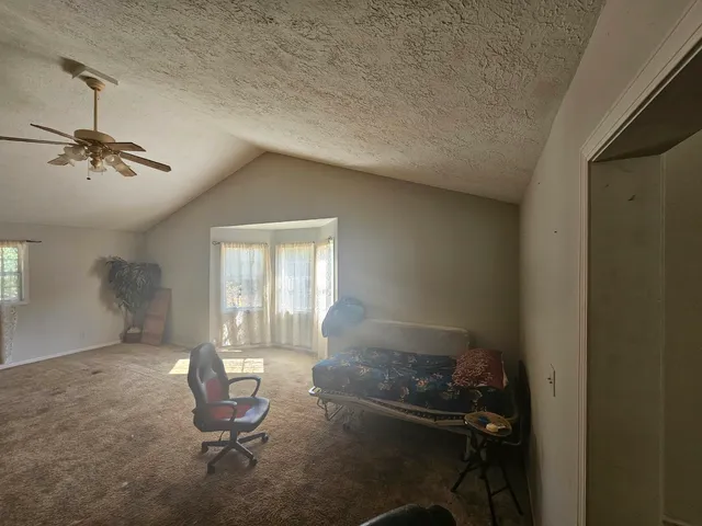 a kitchen with a refrigerator and a stove top oven