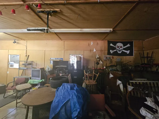 a living room with lots of furniture and a chandelier