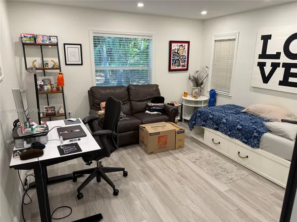 a living room with furniture and a window