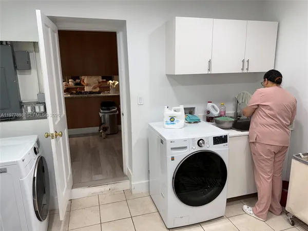 a view of a backyard with wooden fence